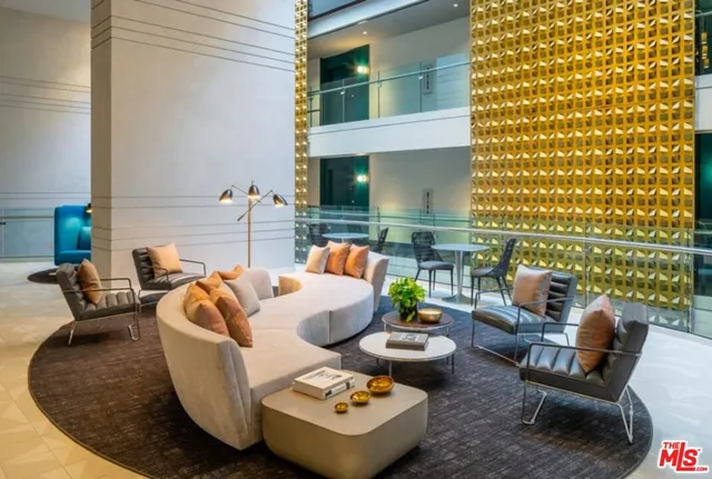 a outdoor living room with furniture and a potted plant