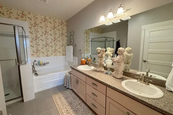 a bathroom with a bathtub and a shower