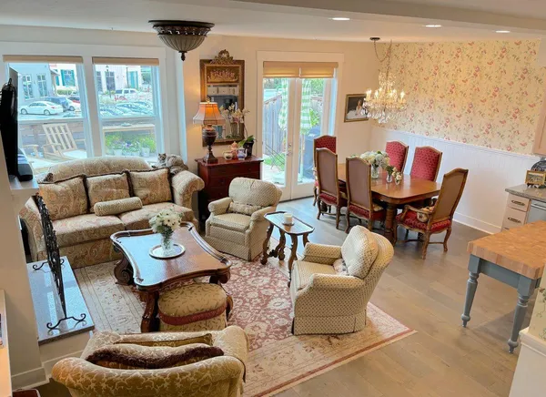 a living room with fireplace furniture and a flat screen tv