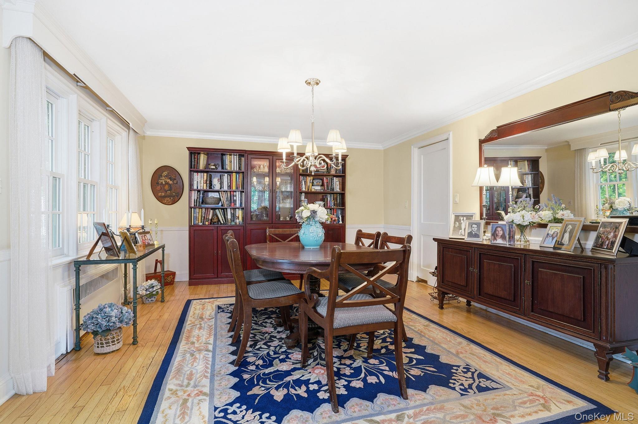 26 Cedarlawn Road Irvington, NY 10533 - Photo 10 of 34 a view of a dining room with furniture and chandelier