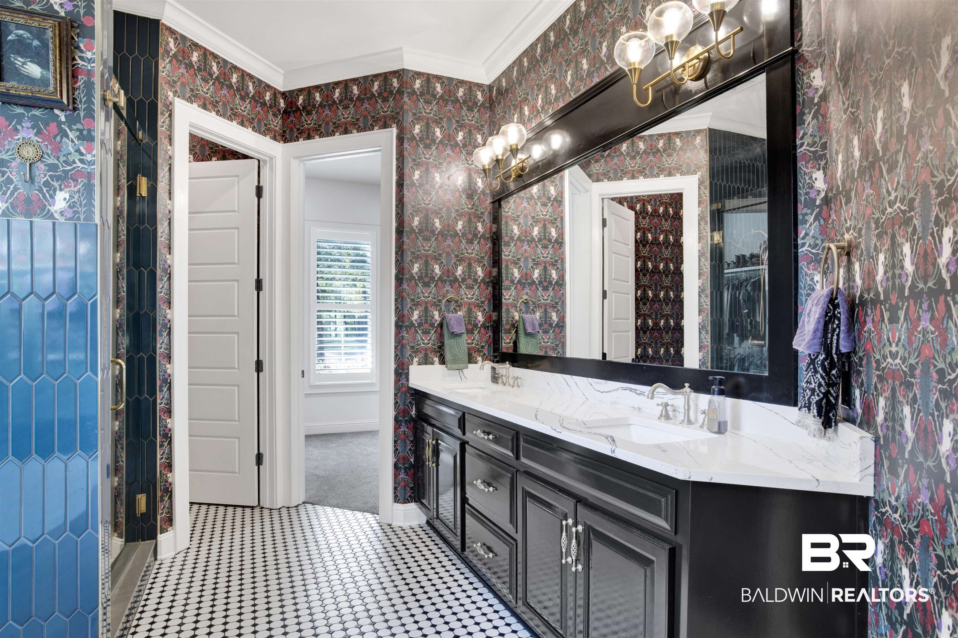 11116 Redfern Road Daphne, AL 36526 - Photo 41 of 46 Full bathroom with wallpapered walls, double vanity, ornamental molding, a shower with door, and a chandelier