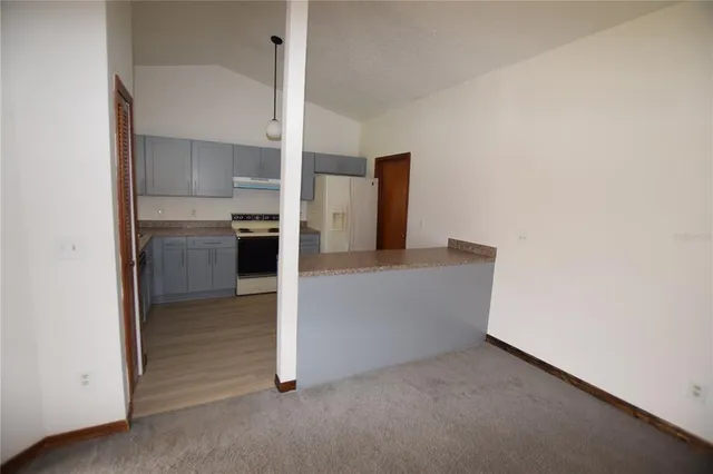 a view of kitchen and wooden floor