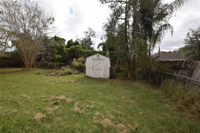 a backyard of a house with lots of green space