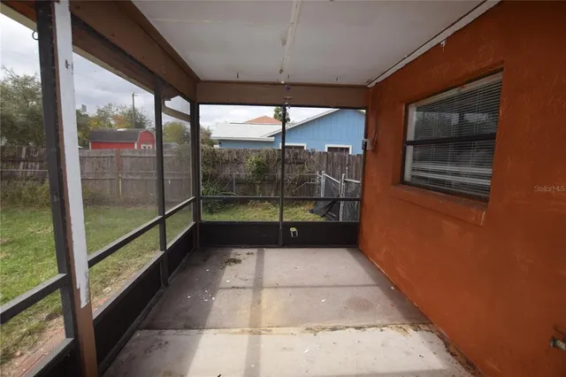 a view of a room with a large window