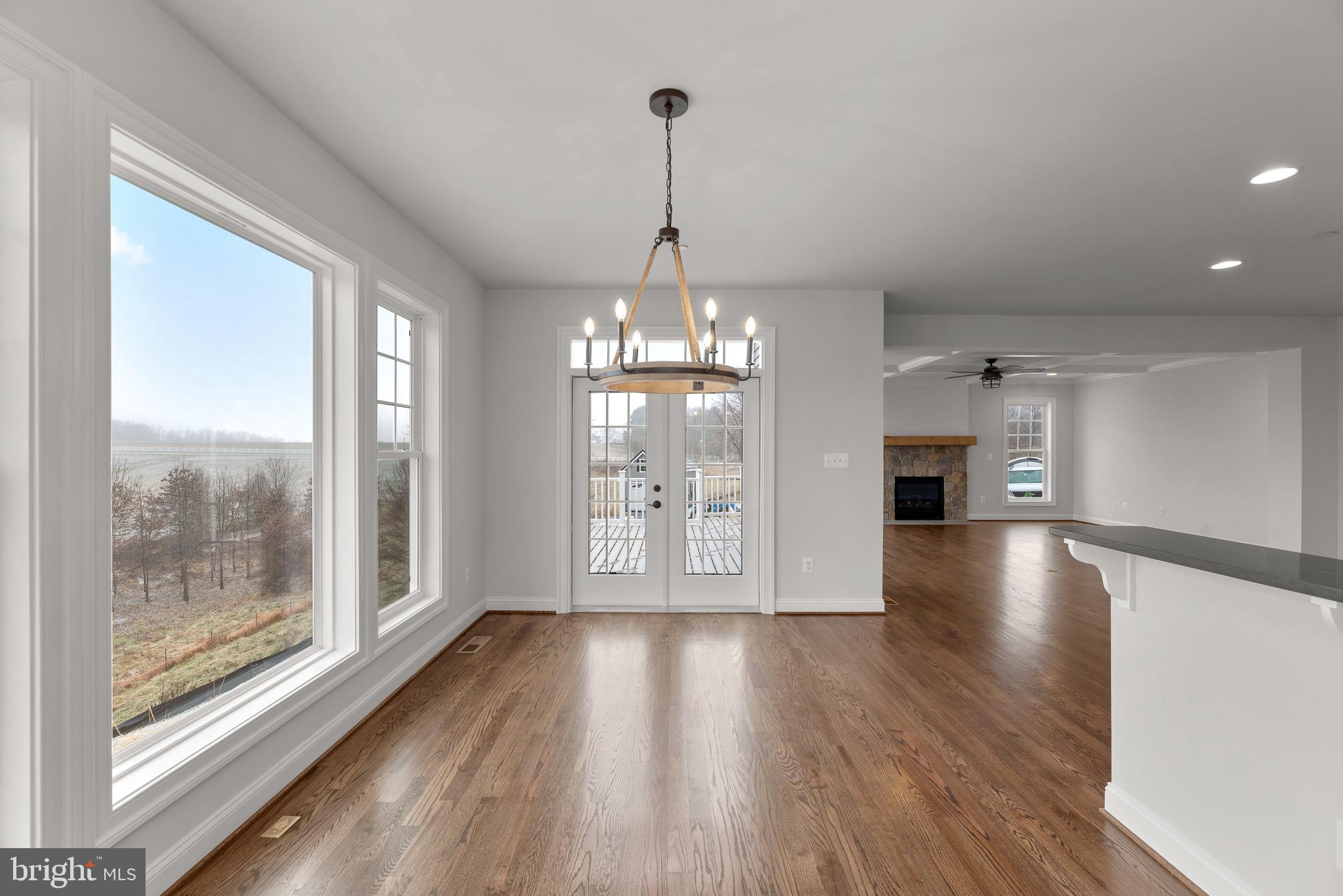 14628 Old Hanover Road, Unit TULARE Reisterstown, MD 21136 - Photo 20 of 60 a view of a room with wooden floor water view and windows