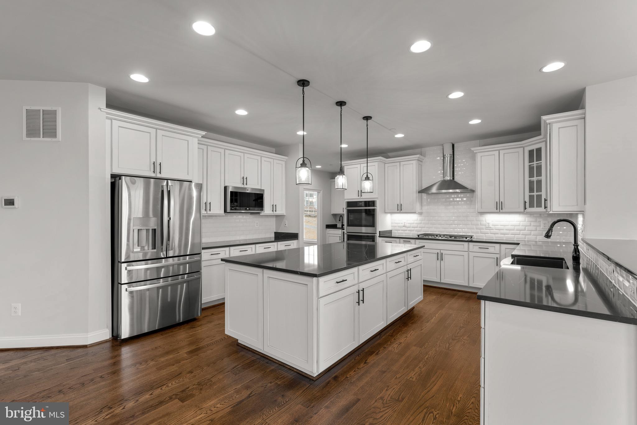 14628 Old Hanover Road, Unit TULARE Reisterstown, MD 21136 - Photo 22 of 60 a kitchen with stainless steel appliances granite countertop a sink stove and refrigerator
