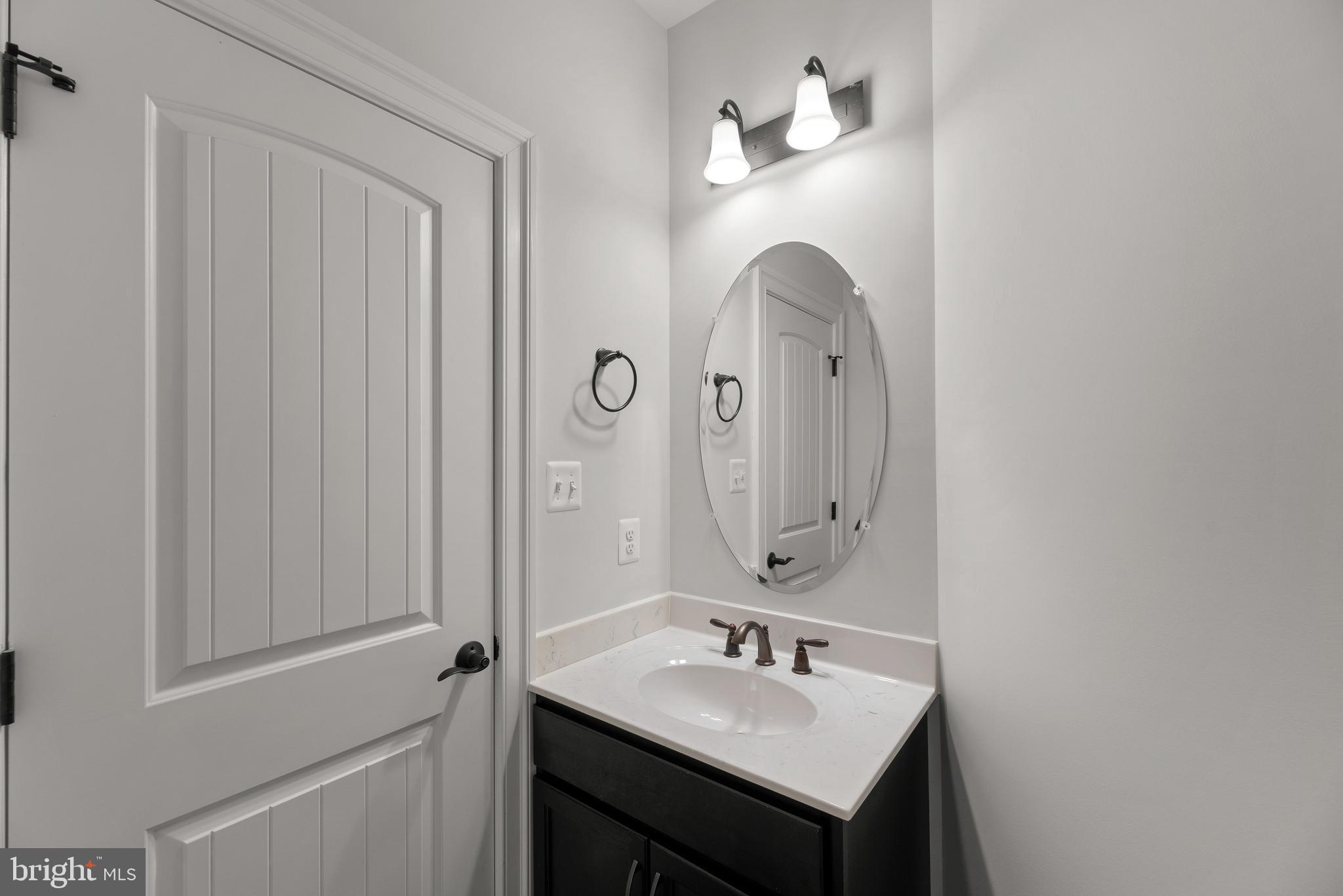 14628 Old Hanover Road, Unit TULARE Reisterstown, MD 21136 - Photo 27 of 60 a bathroom with a sink vanity and a mirror