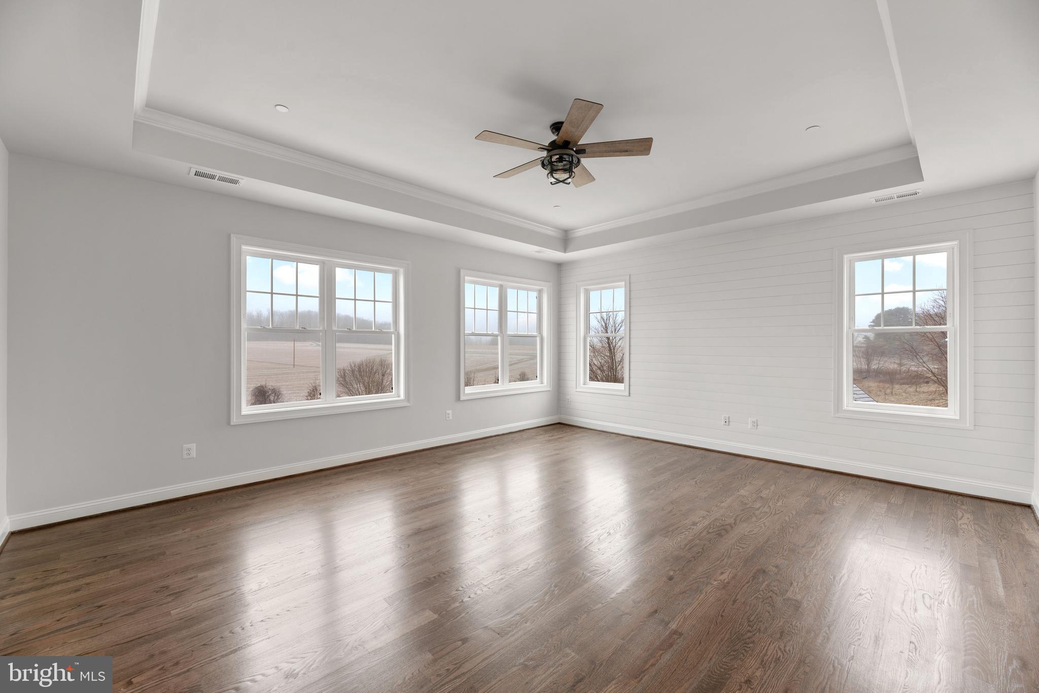 14628 Old Hanover Road, Unit TULARE Reisterstown, MD 21136 - Photo 28 of 60 a view of an empty room with wooden floor and a window