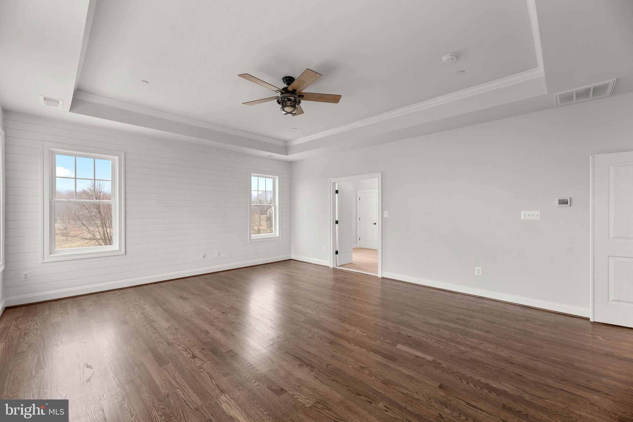 14628 Old Hanover Road, Unit TULARE Reisterstown, MD 21136 - Photo 30 of 60 a view of an empty room with wooden floor and a window