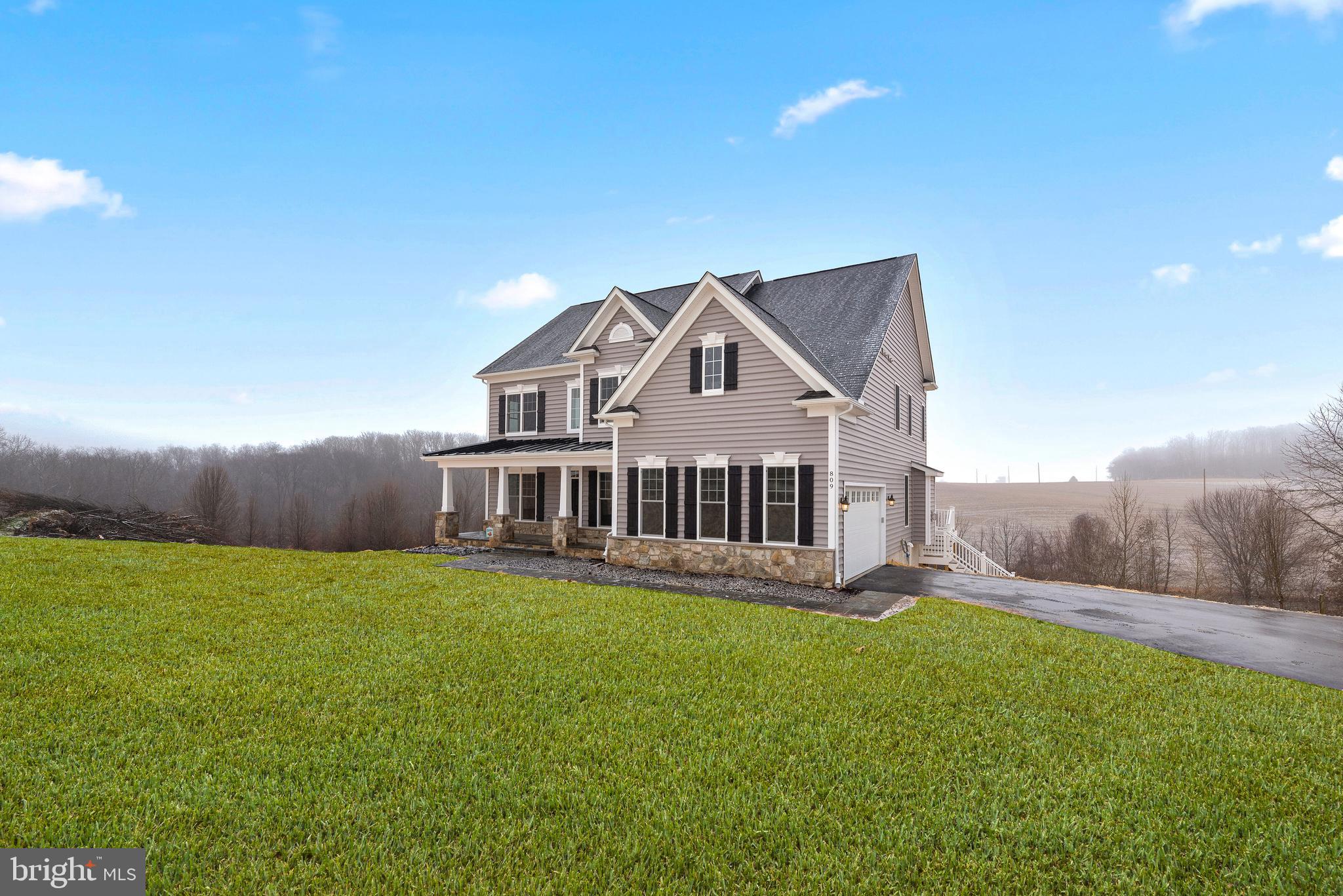 14628 Old Hanover Road, Unit TULARE Reisterstown, MD 21136 - Photo 3 of 60 a view of a house with a yard and sitting area
