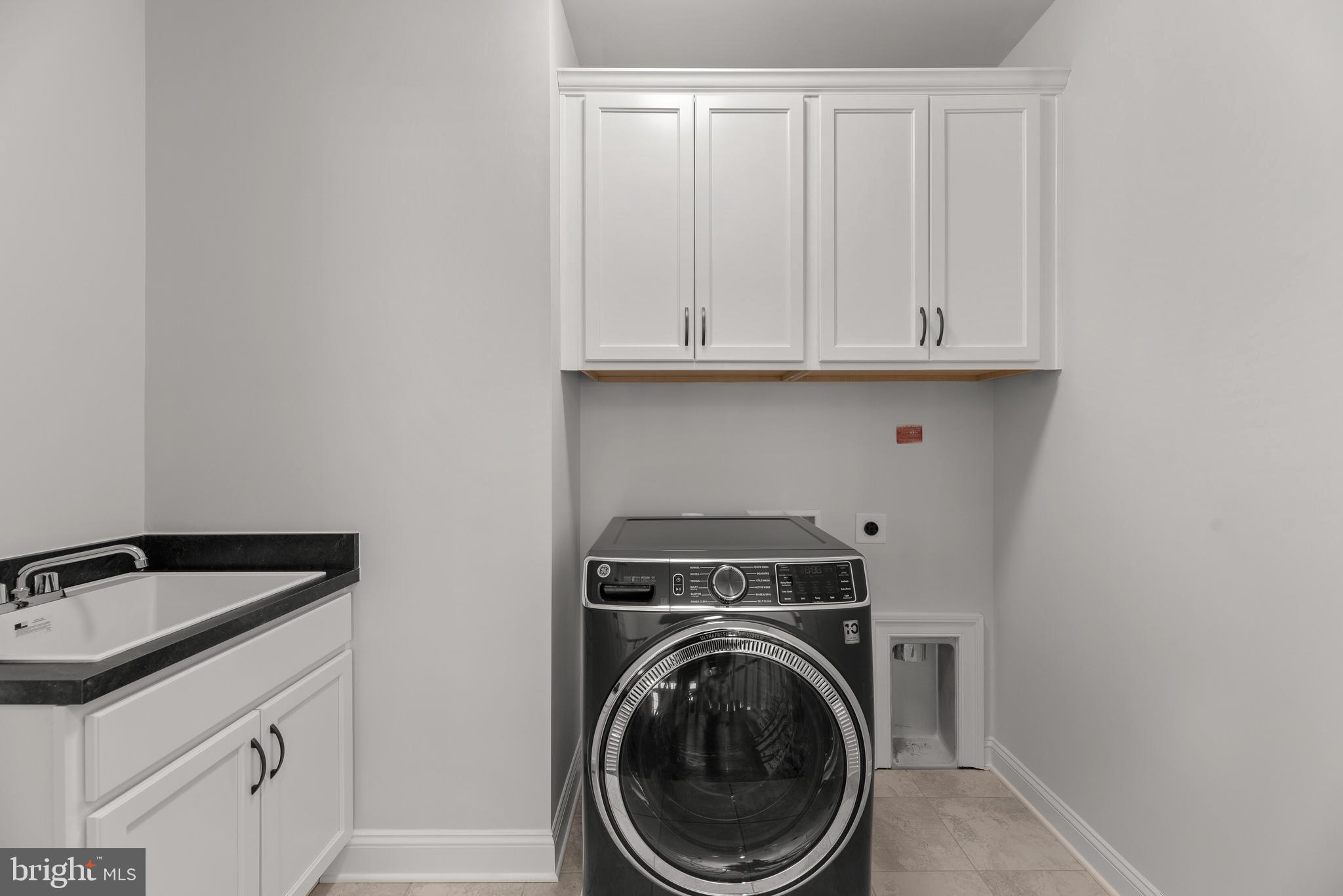 14628 Old Hanover Road, Unit TULARE Reisterstown, MD 21136 - Photo 52 of 60 a utility room with sink dryer and washer