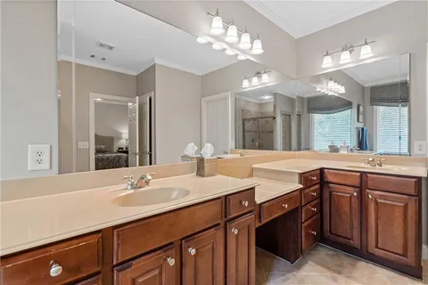 a bathroom with a sink double vanity and a mirror