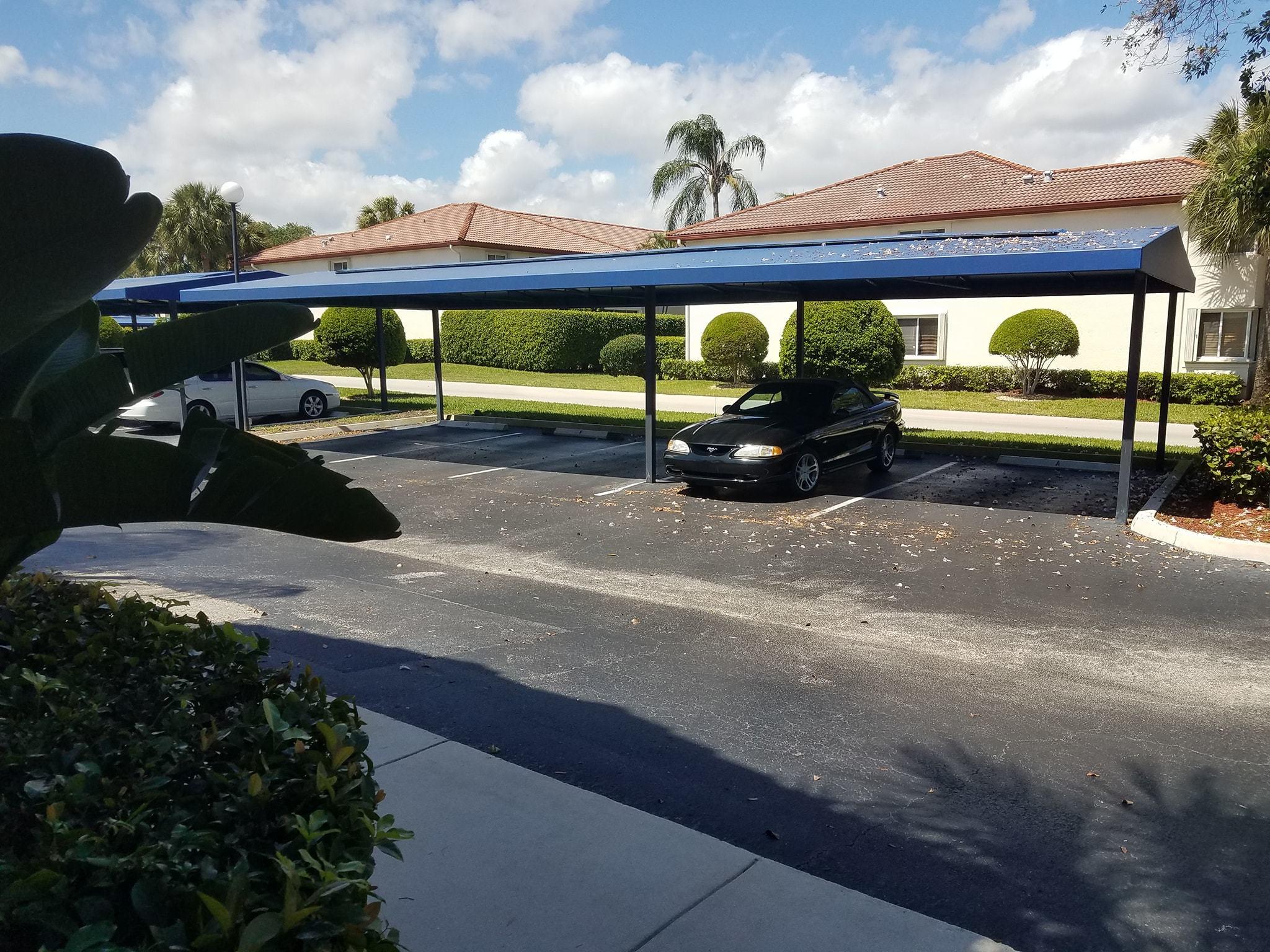 360 Northwest 67th Street, Unit E102 Boca Raton, FL 33487 - Photo 36 of 36 Assigned covered parking spot
