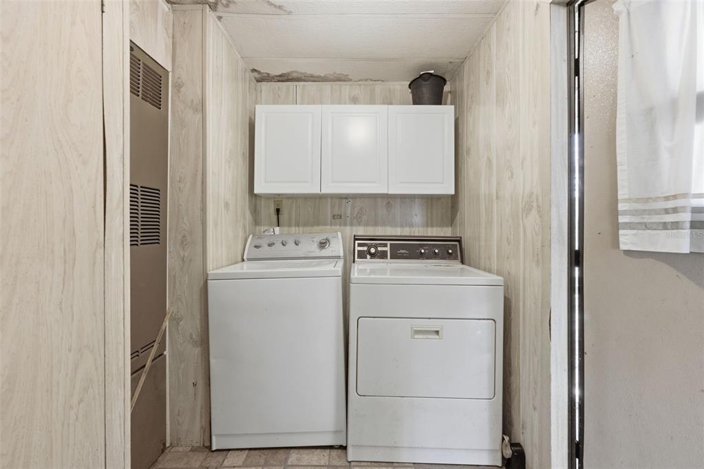 8045 Indian Trail Road Weeki Wachee, FL 34613 - Photo 11 of 49 a utility room with dryer and washer