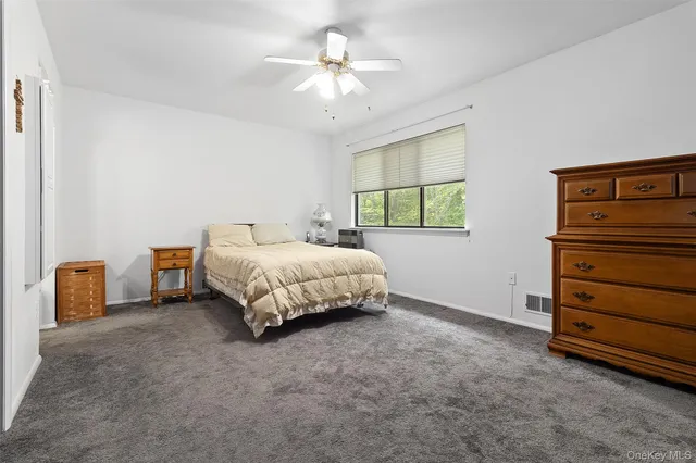 a bedroom with a bed and a cabinets