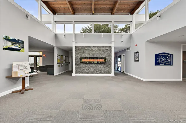 a view of an empty room with a fireplace