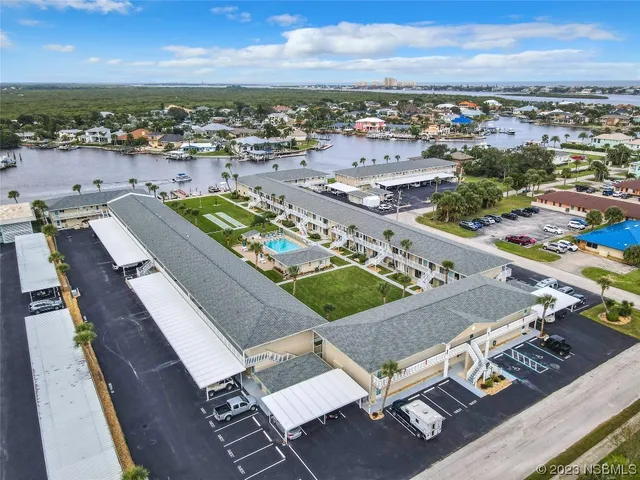 a front view of a house with a swimming pool