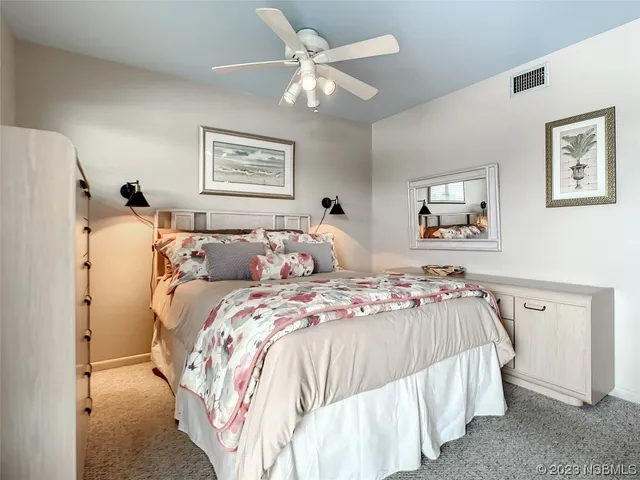 a bedroom with double bed and a window