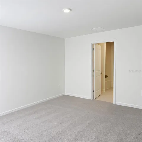 a white toilet sitting next to a white sink