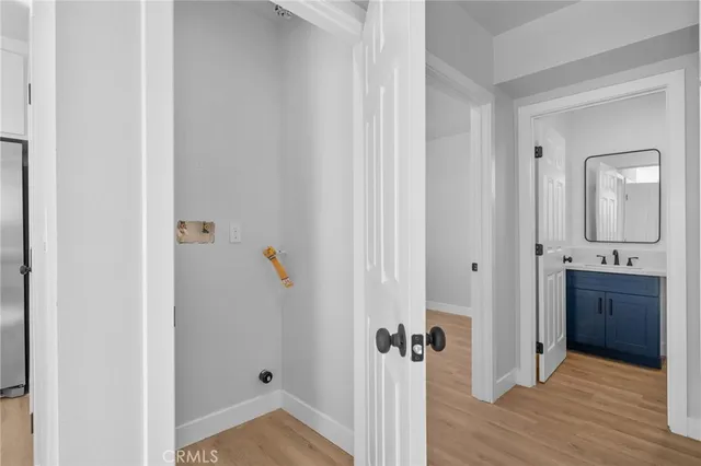 a view of a bathroom from the hallway