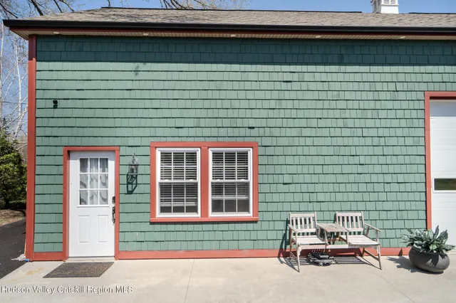 a couple of cars parked in front of a house