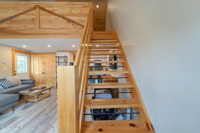 a view of staircase with white walls