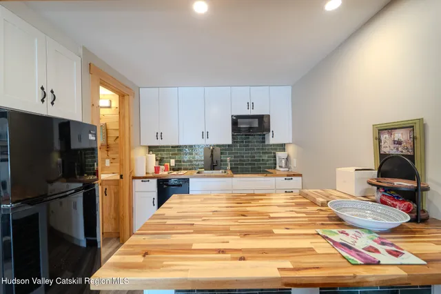 a room with a bed and furniture