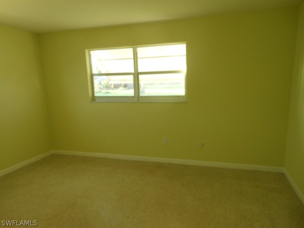 803 East Bougainvillea Road Lehigh Acres, FL 33936 - Photo 13 of 20 a view of a small space with a window
