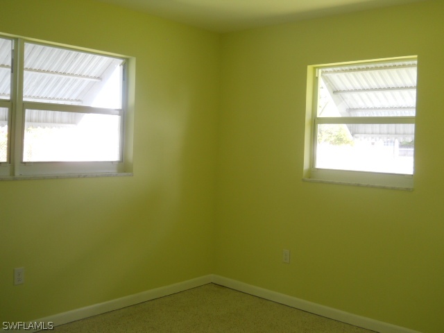 803 East Bougainvillea Road Lehigh Acres, FL 33936 - Photo 18 of 20 a view of a small space with window and a window