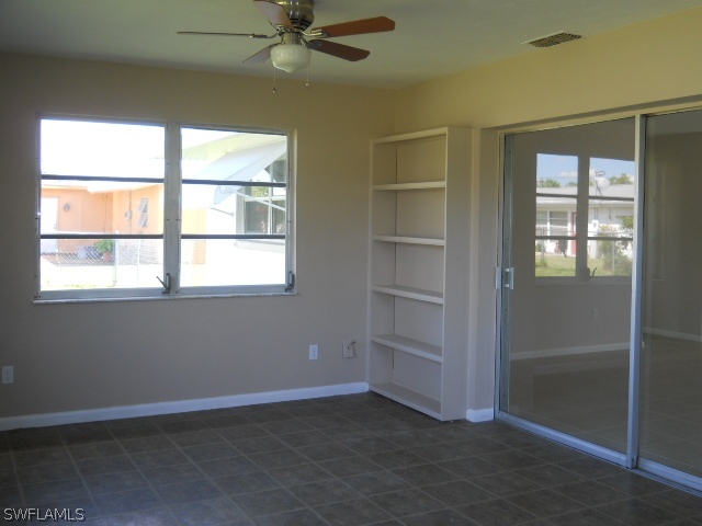 803 East Bougainvillea Road Lehigh Acres, FL 33936 - Photo 19 of 20 an empty room with windows and closet
