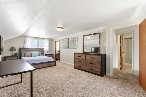 a room with furniture and a dresser