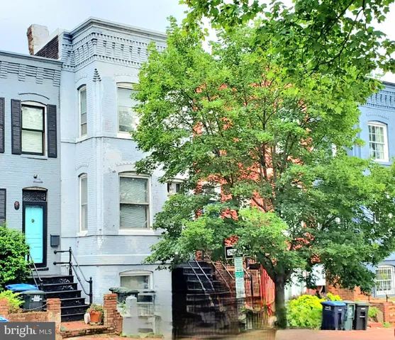 a view of a building with a tree