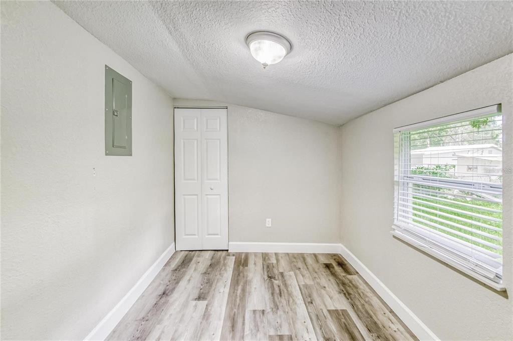 5320 Cherry Avenue Seffner, FL 33584 - Photo 13 of 21 a view of a room with wooden floor and window
