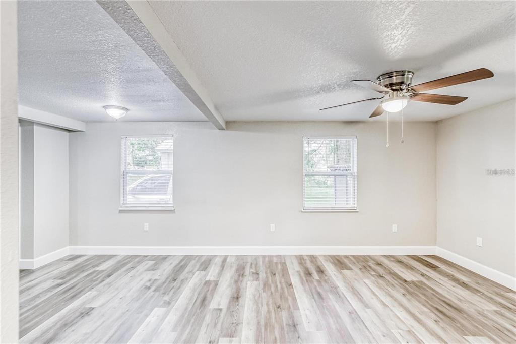 5320 Cherry Avenue Seffner, FL 33584 - Photo 14 of 21 wooden floor in an empty room with a window