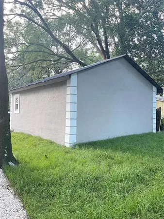 a backyard of a house with lots of green space