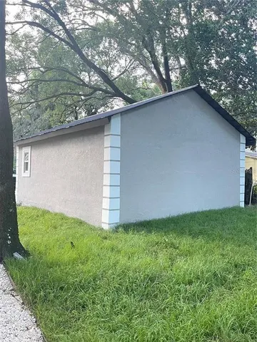 a backyard of a house with lots of green space