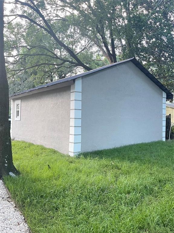 5320 Cherry Avenue Seffner, FL 33584 - Photo 17 of 21 a backyard of a house with lots of green space