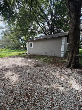 a house with a tree in the background