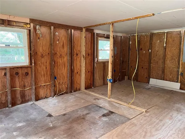 a view of a room with a furniture and windows