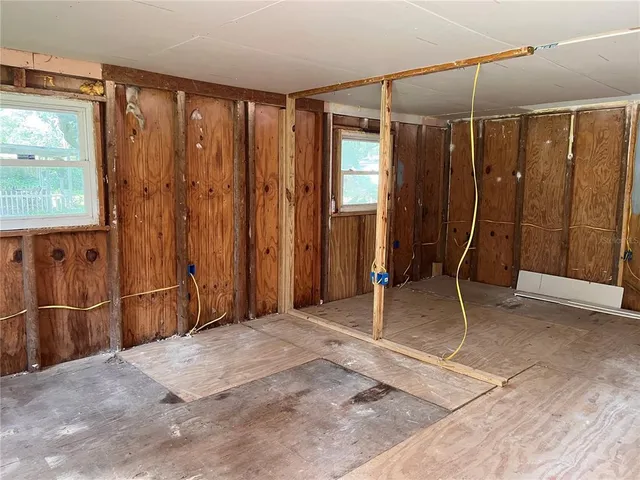 a view of a room with a furniture and windows