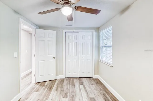 a view of an empty room with a window