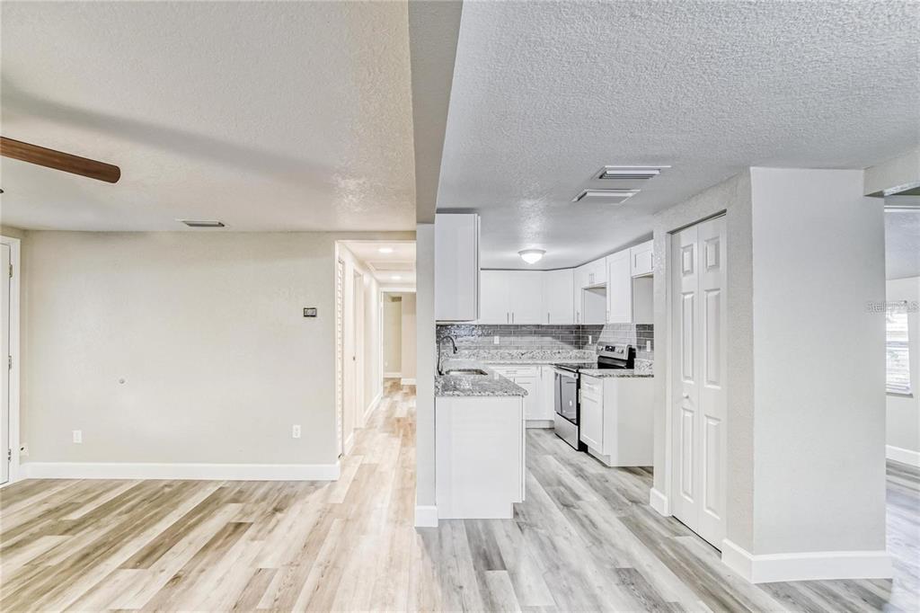 5320 Cherry Avenue Seffner, FL 33584 - Photo 6 of 21 a kitchen with stainless steel appliances a refrigerator and a stove top oven