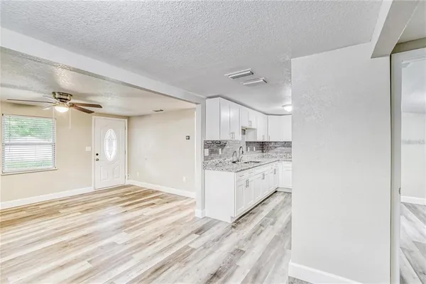 a bathroom with a sink a vanity and a mirror