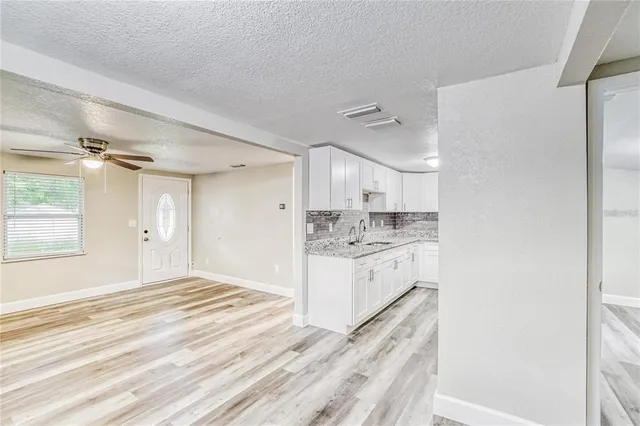 a bathroom with a sink a vanity and a mirror