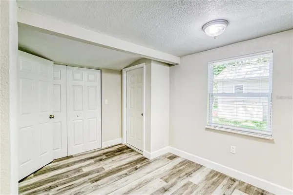 a view of an empty room with a window