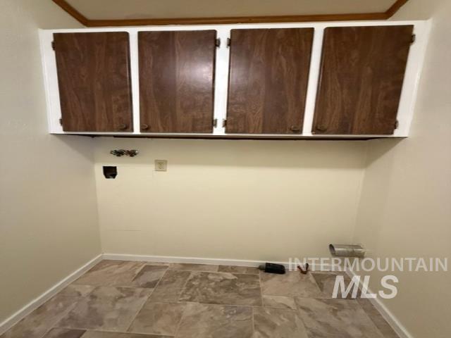 1360 Pioneer Road Weiser, ID 83672 - Photo 24 of 47 Utility area with four wood-finish upper cabinets