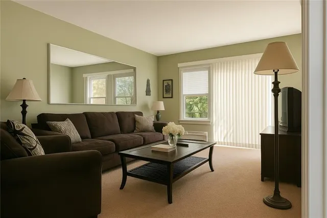 a living room with furniture and a window