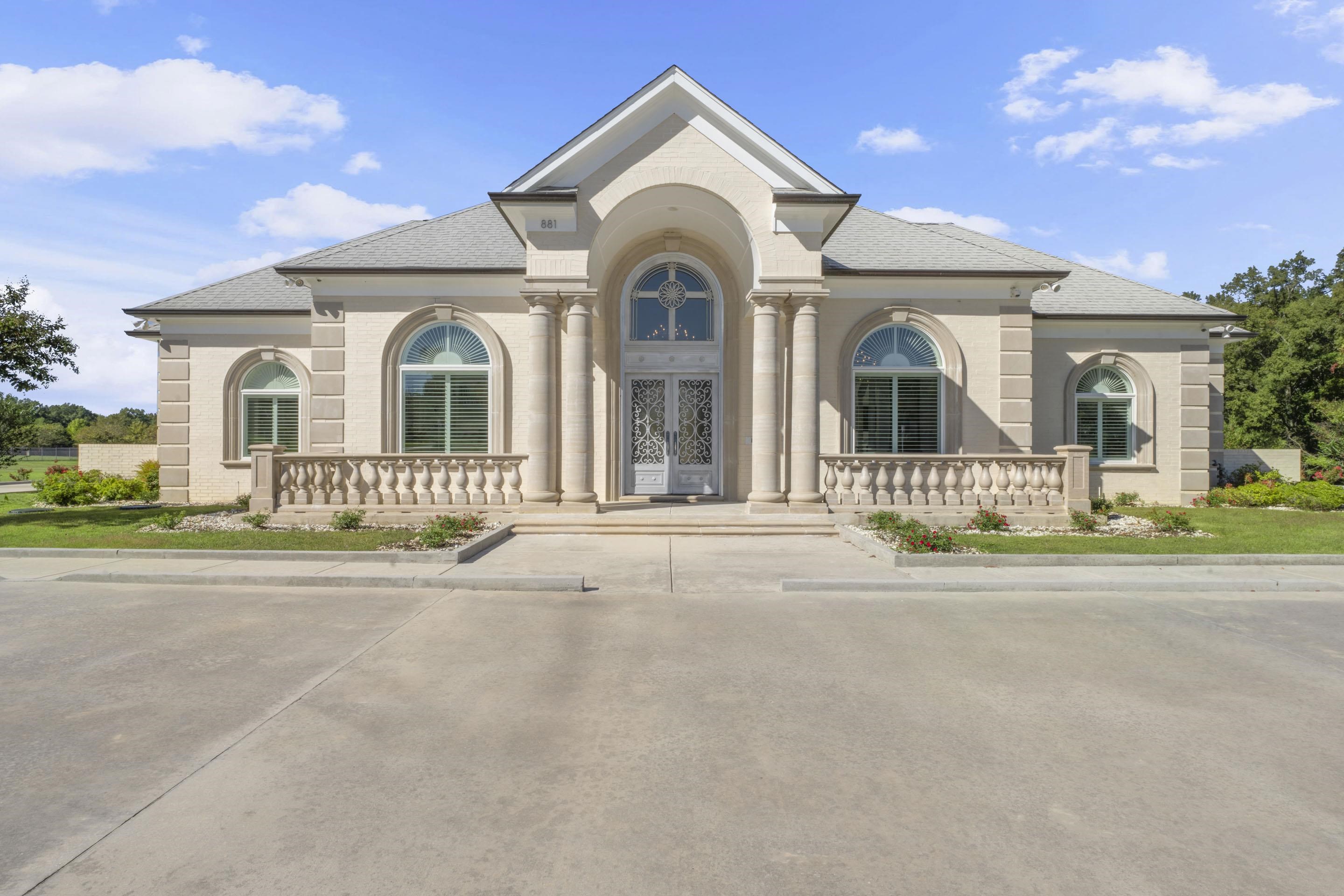 front view of a house with a yard