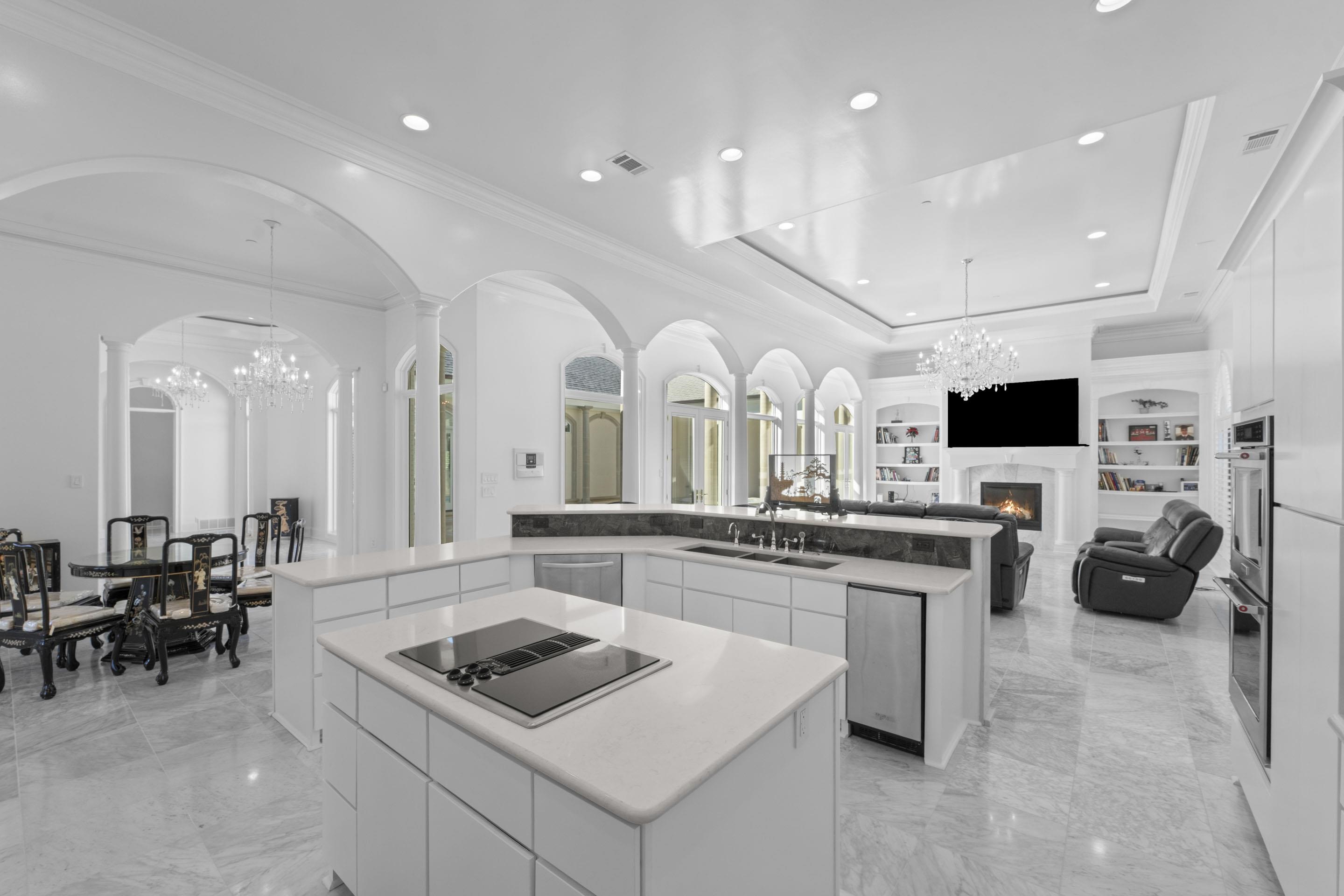 881 Bray Station Road Collierville, TN 38017 - Photo 40 of 40 a kitchen with stainless steel appliances a stove a sink a microwave a dining table and chairs