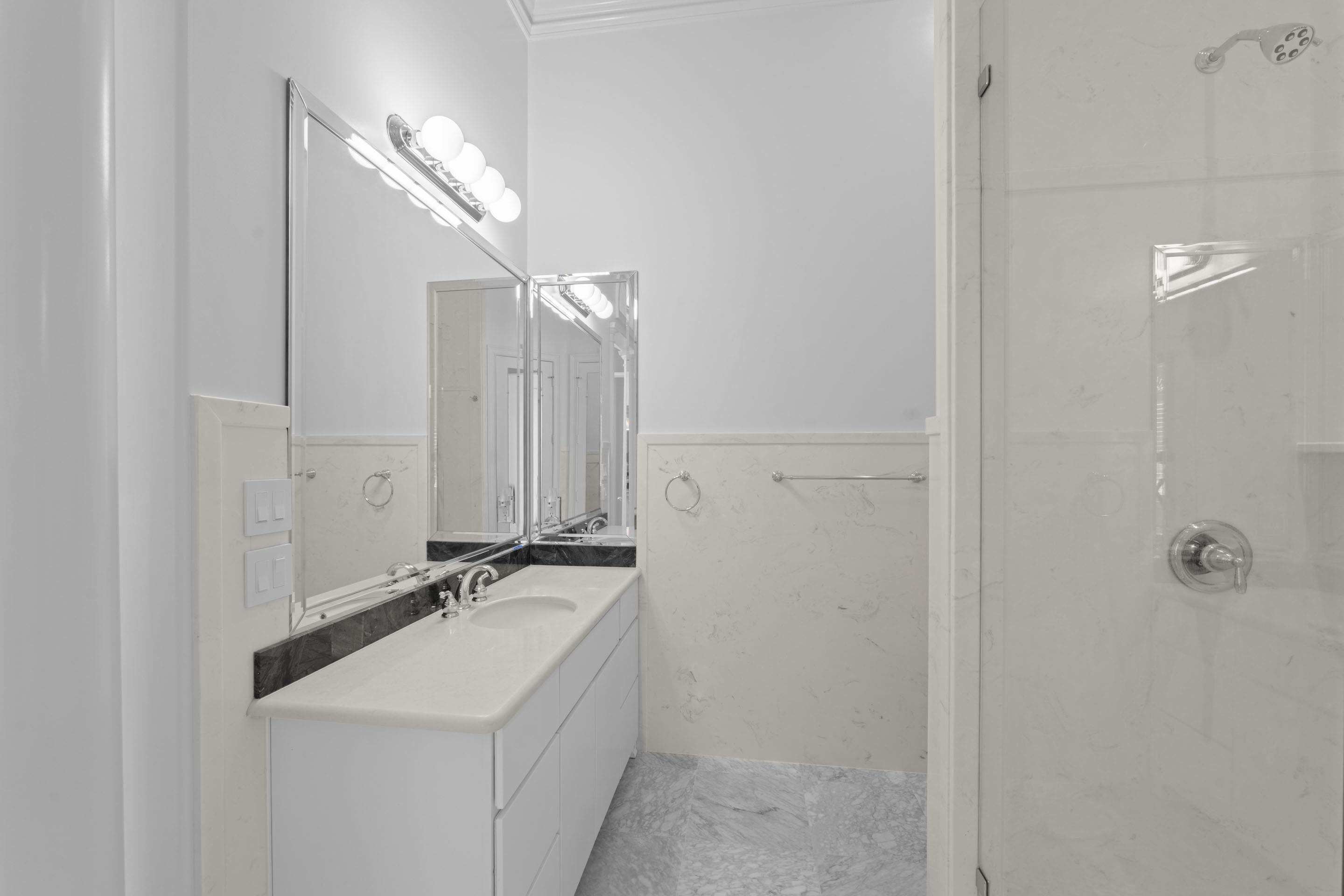 881 Bray Station Road Collierville, TN 38017 - Photo 18 of 40 a bathroom with a sink and a mirror